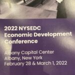 Text saying, "2022 NYSEDC Economic Development Conference. Albany Capital Center. Albany, New York. February 28 & March 1, 2022"