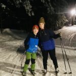 Two skiers smiling at camera